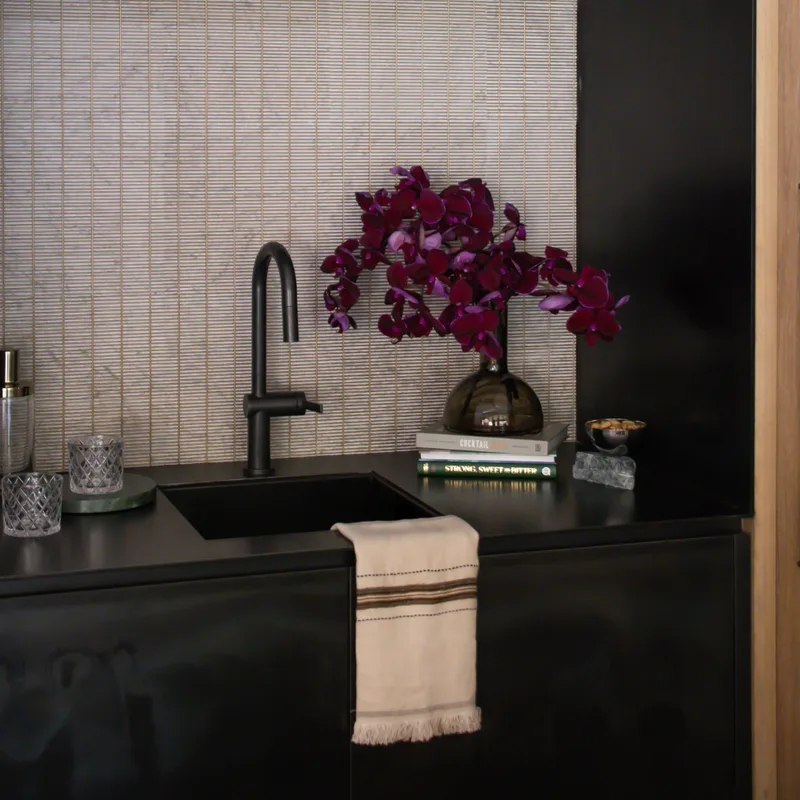Styled interior with a finished stone surface