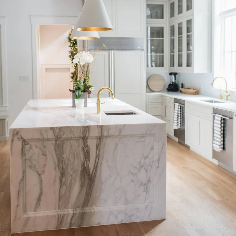 Finished residential kitchen with a stone countertop